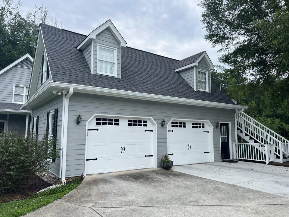 Garage repaint with gray siding and white trim by Encompass Contracting in Watkinsville, GA