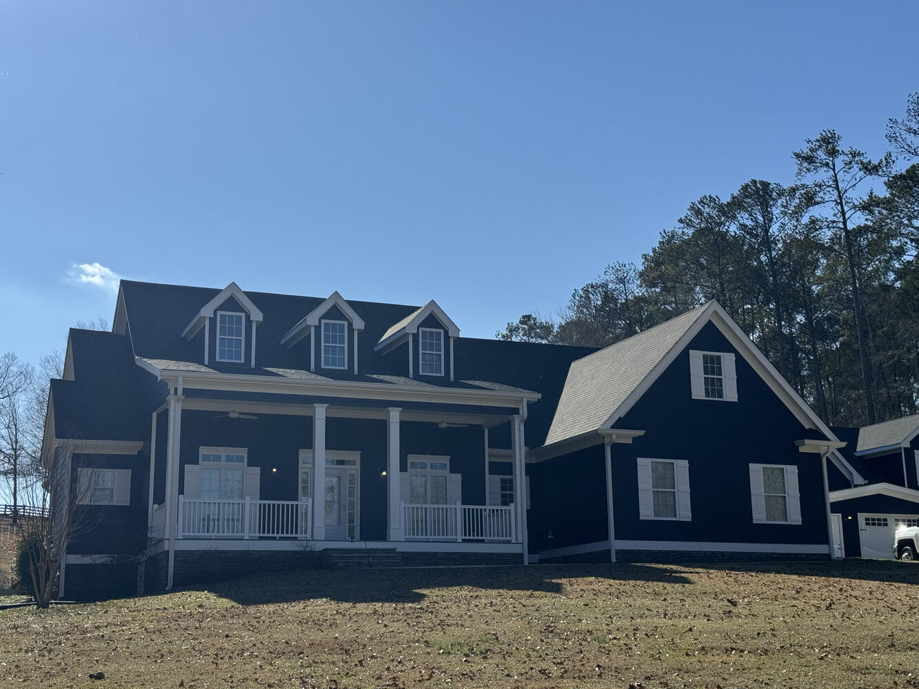 Large navy-blue exterior repaint by Encompass Contracting in Athens, GA Large navy-blue exterior repaint by Encompass Contracting in Athens, GA