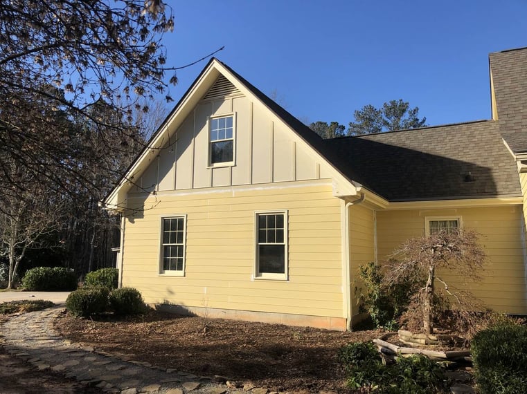 Yellow siding remodel on gable wall in Bishop, GA by Encompass Contracting