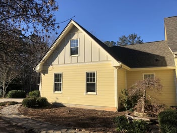 Yellow siding on a two-story, single-family home in Athens, GA.