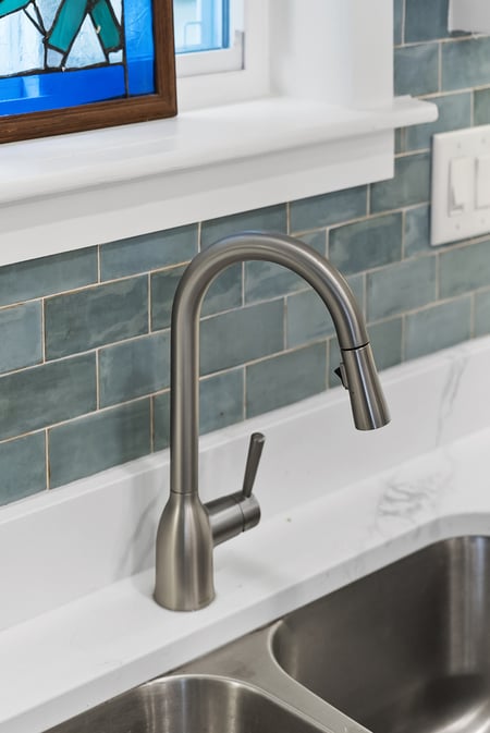 New stainless sink and faucet in remodeled Watkinsville, GA kitchen by Encompass Contracting