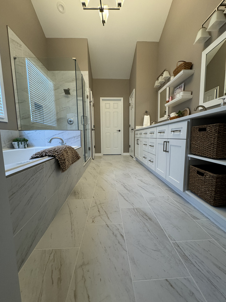 Custom bathroom remodel in Statham, Georgia by Encompass Contracting showcasing long vanity and freestanding tub