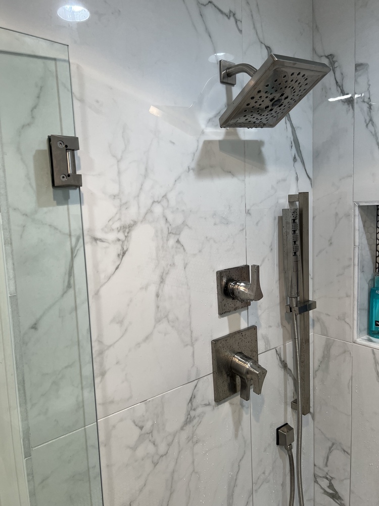 Rainfall showerhead installation in Statham bathroom remodel by Encompass Contracting