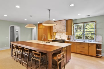 Brookhaven kitchen remodel with wood cabinetry and marble backsplash by Encompass Contracting