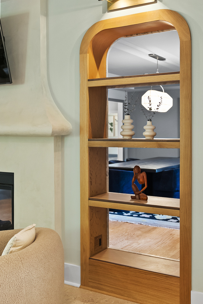 Built-in wood shelving with decorative accents in Brookhaven whole home remodel by Encompass Contracting