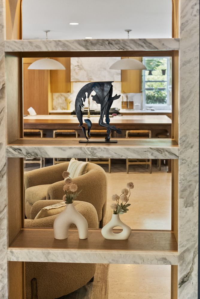 Decorative shelving with sculptural accents in Brookhaven whole home remodel by Encompass Contracting