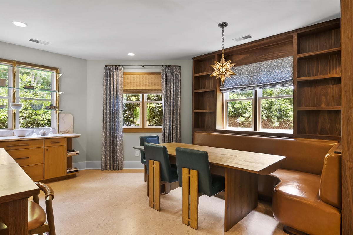 Dining nook remodel with custom banquette seating in Brookhaven by Encompass Contracting