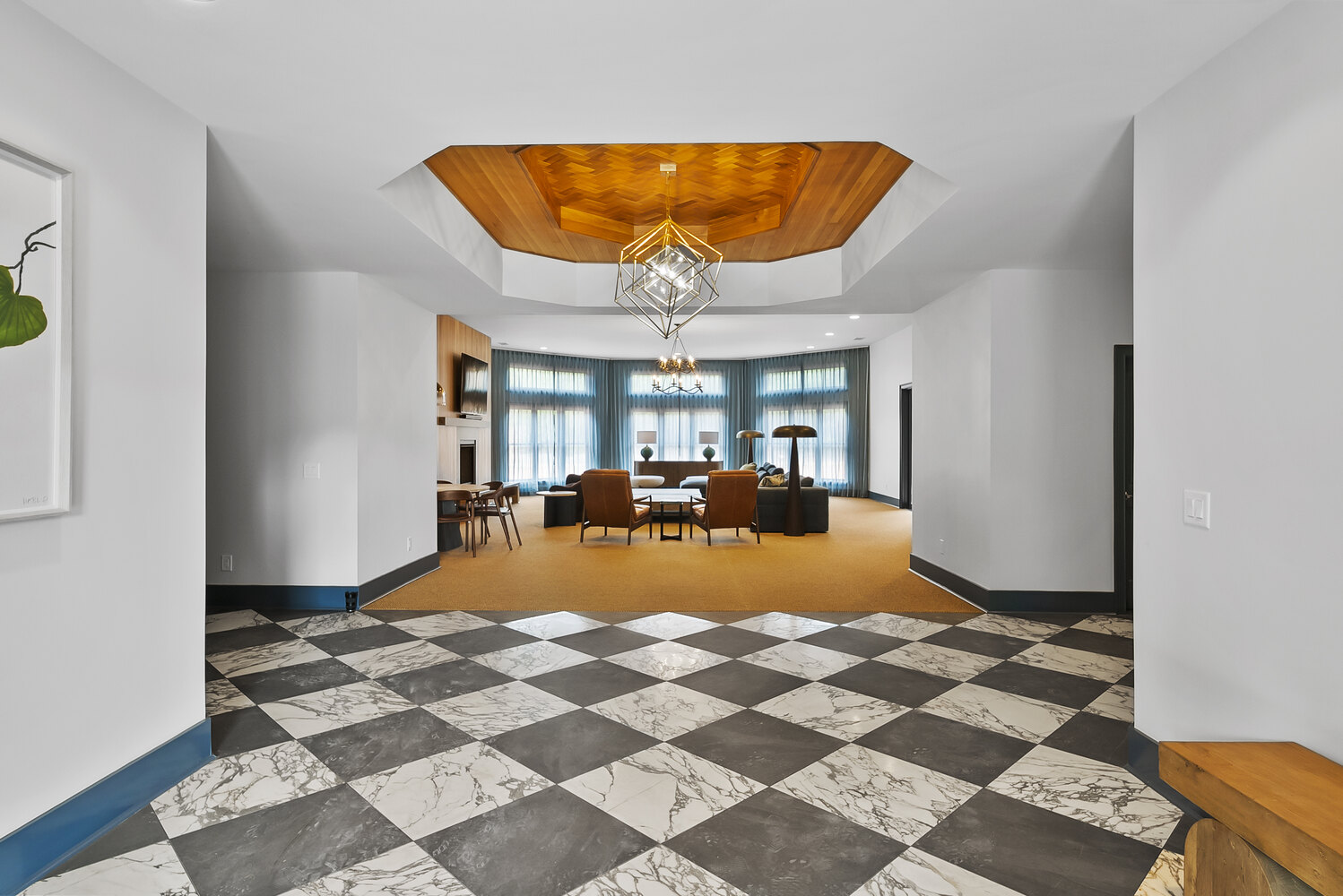 Entryway remodel with wood ceiling and chandelier in Brookhaven by Encompass Contracting