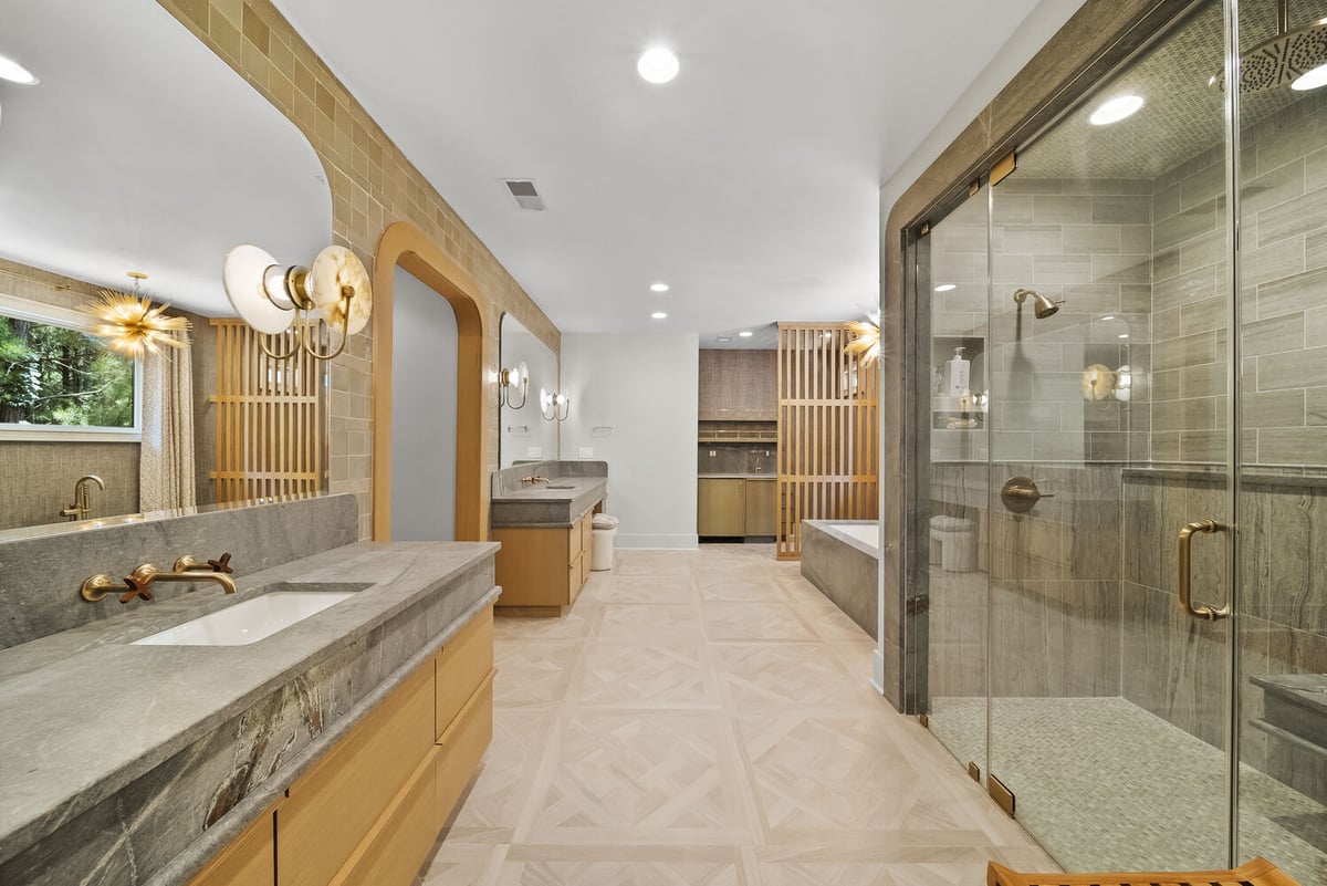 Luxury double vanity and glass shower in Brookhaven bathroom remodel by Encompass Contracting