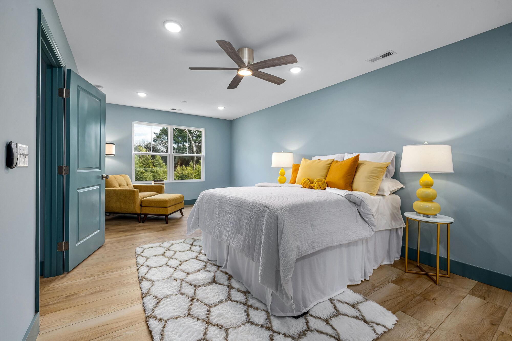 Bedroom remodel with blue accent walls by Encompass Contracting in Athens, GA - stock