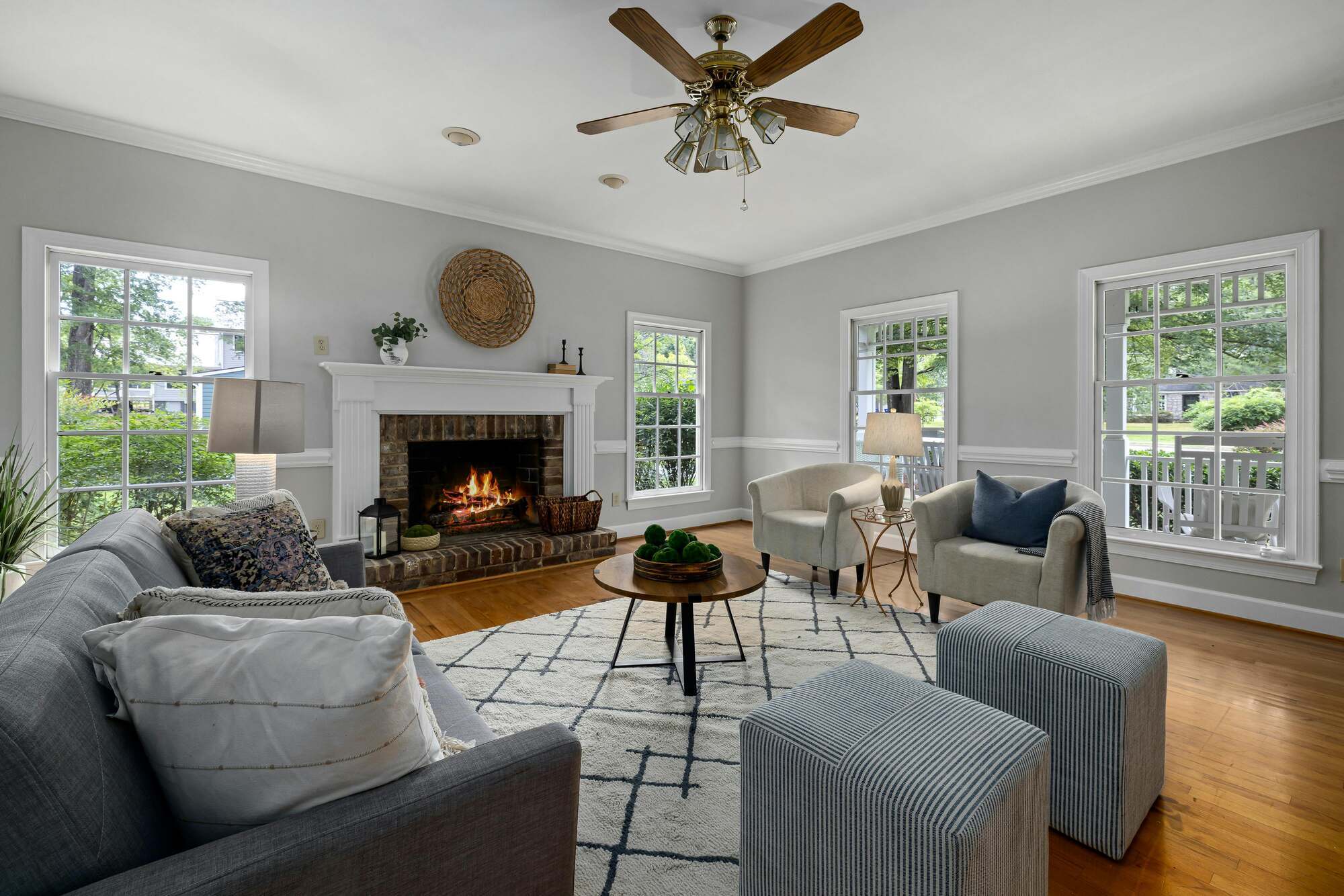 Bright living room remodel with fireplace by Encompass Contracting in Athens, GA - stock