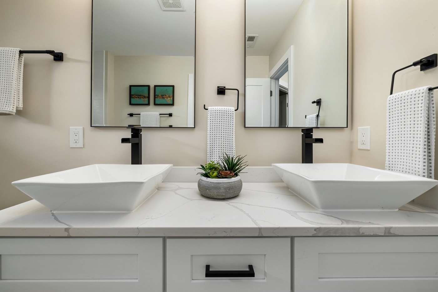 Contemporary bathroom remodel in Athens, GA with dual vessel sinks by Encompass Contracting - stock