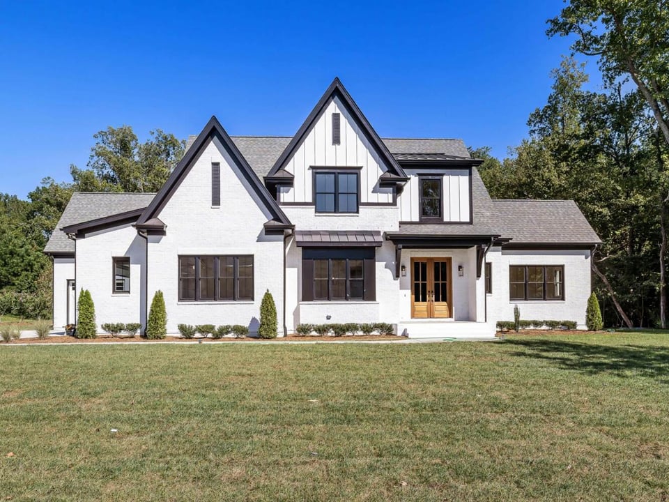Custom modern farmhouse in Athens, GA with white James Hardie siding by Encompass Contracting - stock
