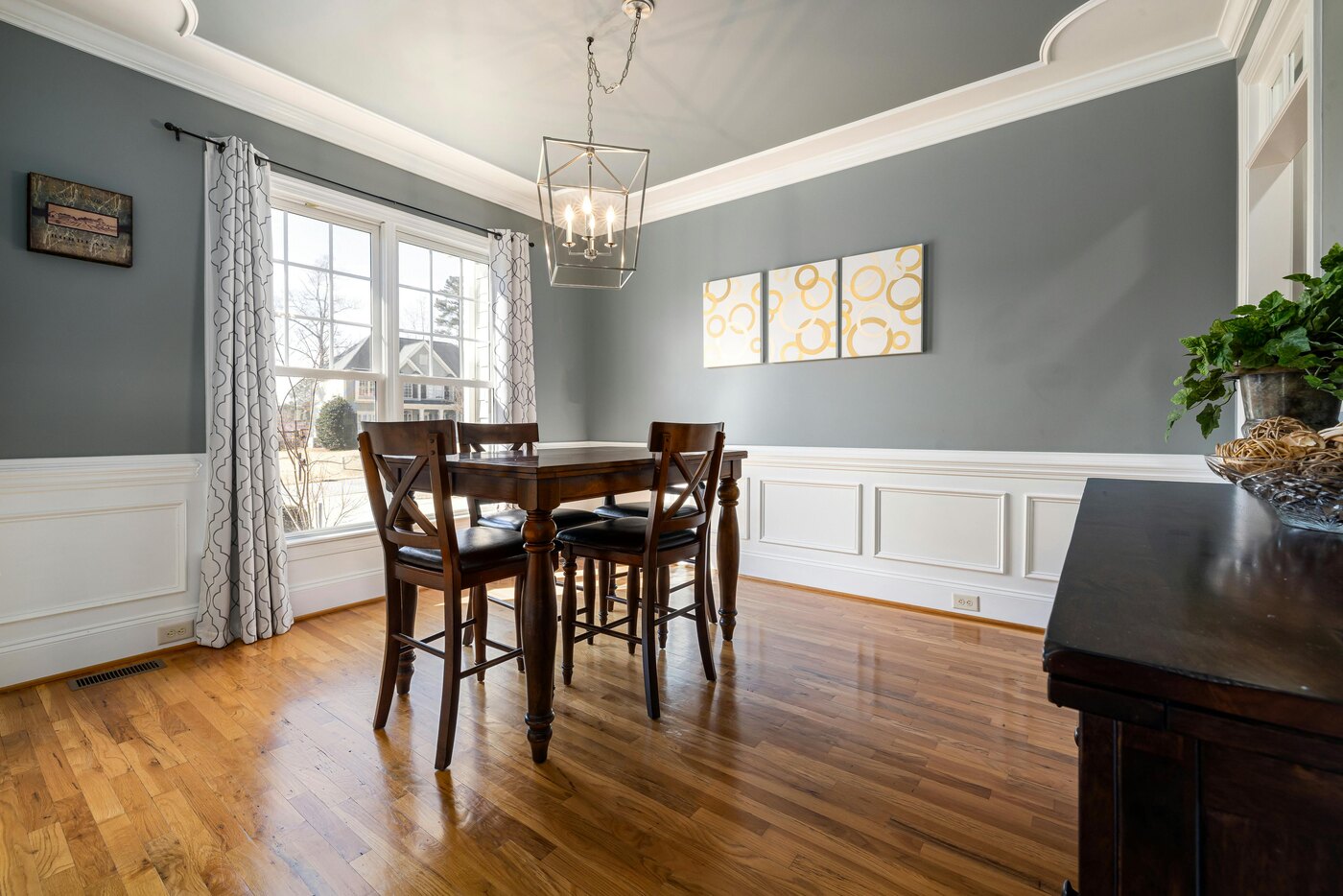Dining room remodel with a gray accent wall by Encompass Contracting in Athens, GA