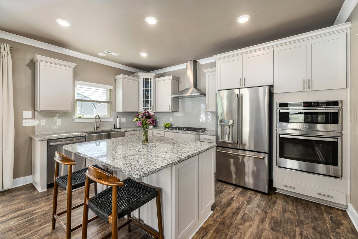 Kitchen remodel with granite countertops and an island by Encompass Contracting in Athens, GA