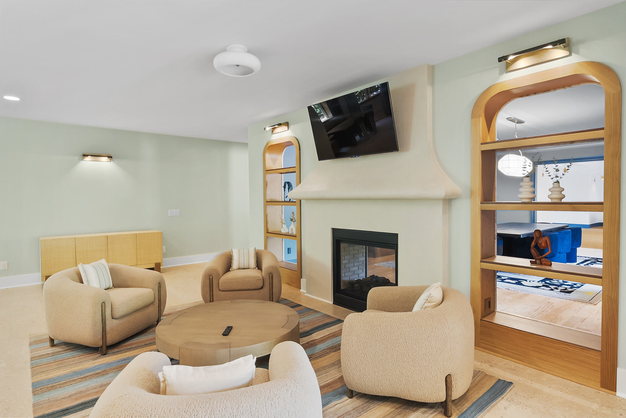Brookhaven whole home remodel living room with modern fireplace and built-in shelving by Encompass Contracting