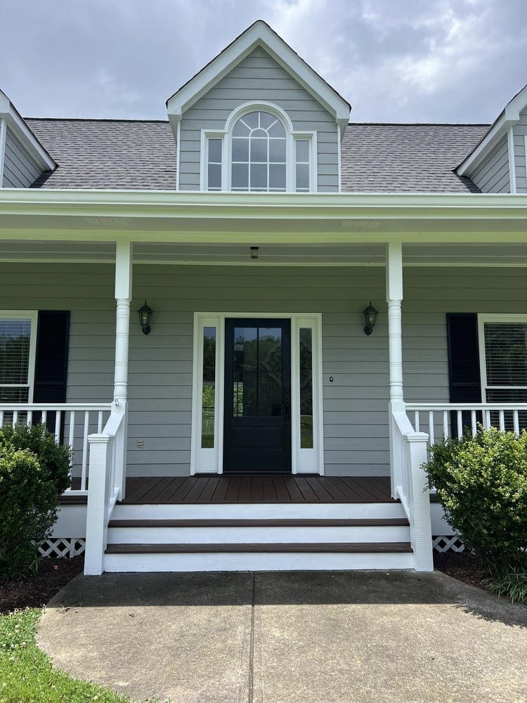 Gray siding exterior repaint with dark shutters by Encompass Contracting in Watkinsville, GA