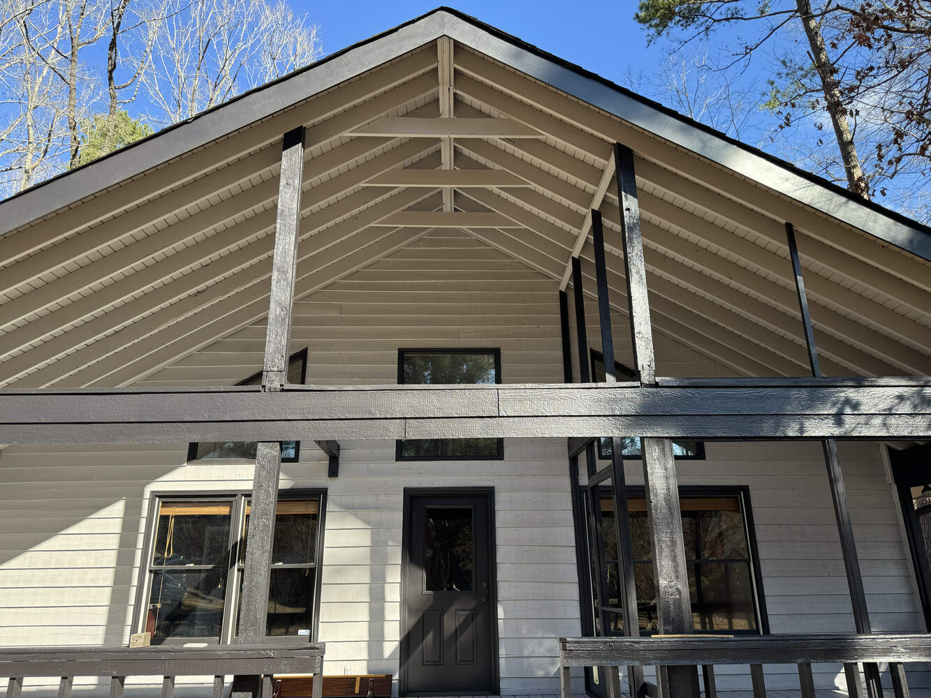 Porch exterior repaint with light beige siding by Encompass Contracting in Bishop, GA
