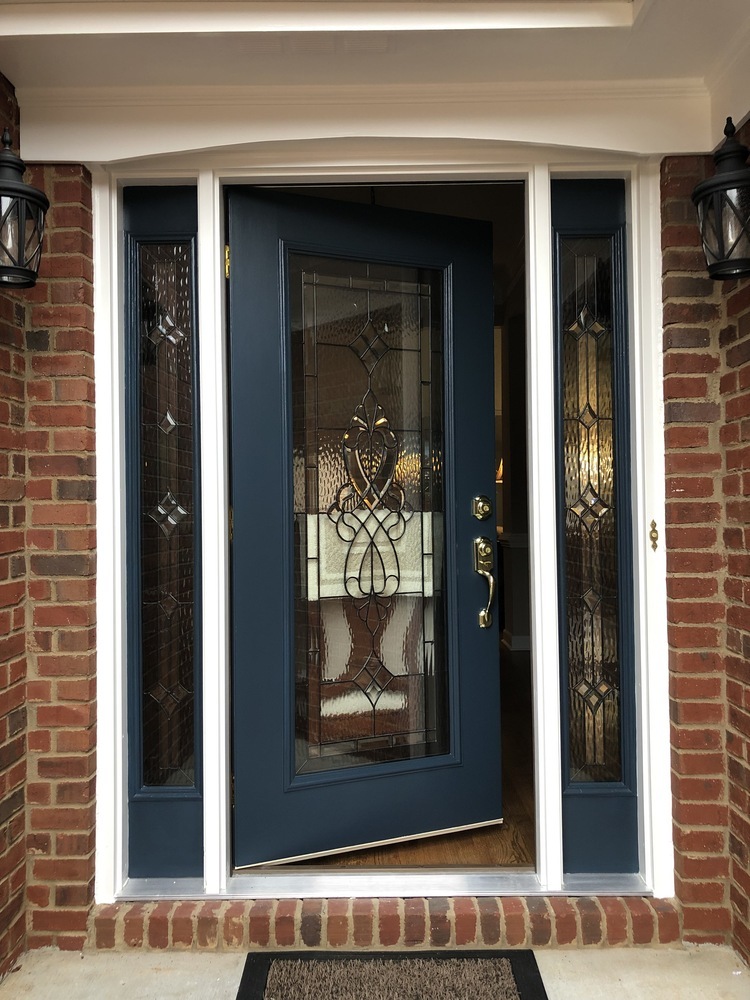 Blue front door with glass detail installed in Bishop, GA by Encompass Contracting