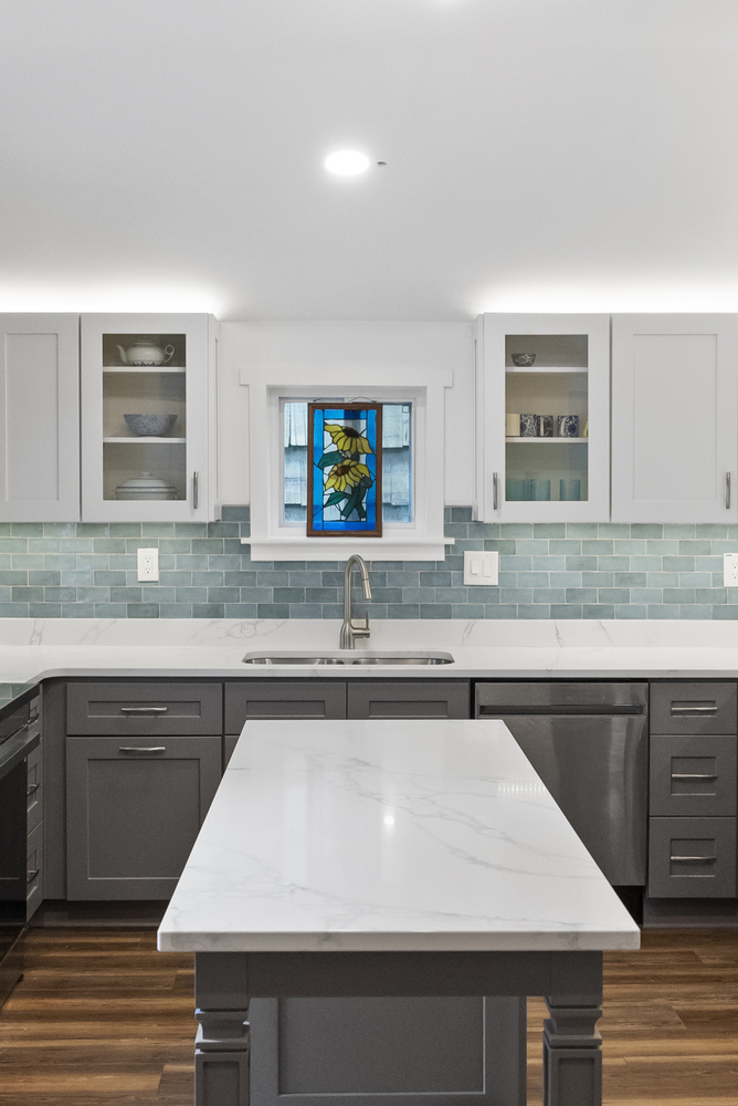 Custom kitchen remodel with stained-glass window accent in Bishop, GA by Encompass Contracting