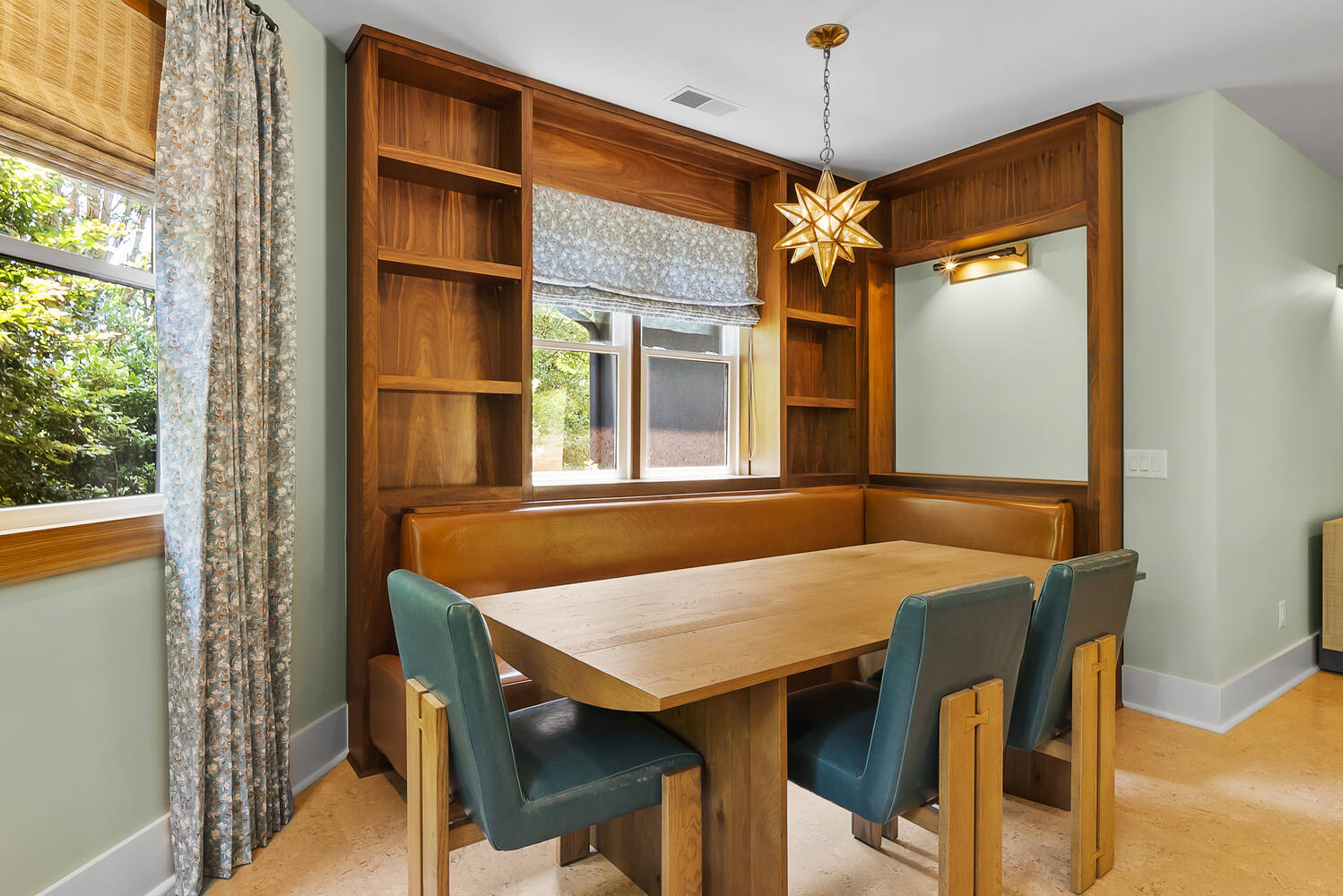 Built-in banquette seating with wood shelving in Brookhaven kitchen remodel by Encompass Contracting