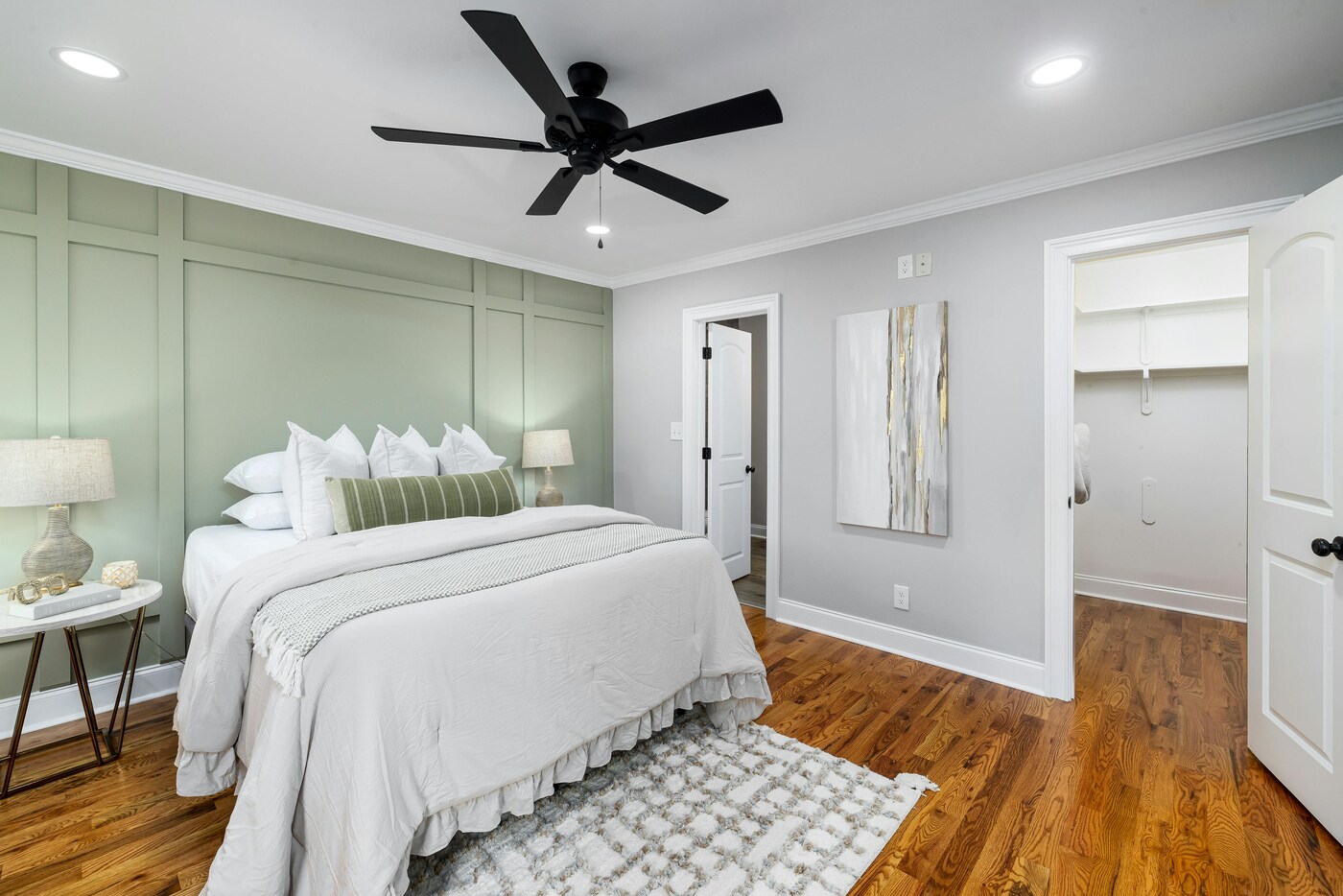 Bedroom remodel with green accent wall by Encompass Contracting in Athens, GA - stock