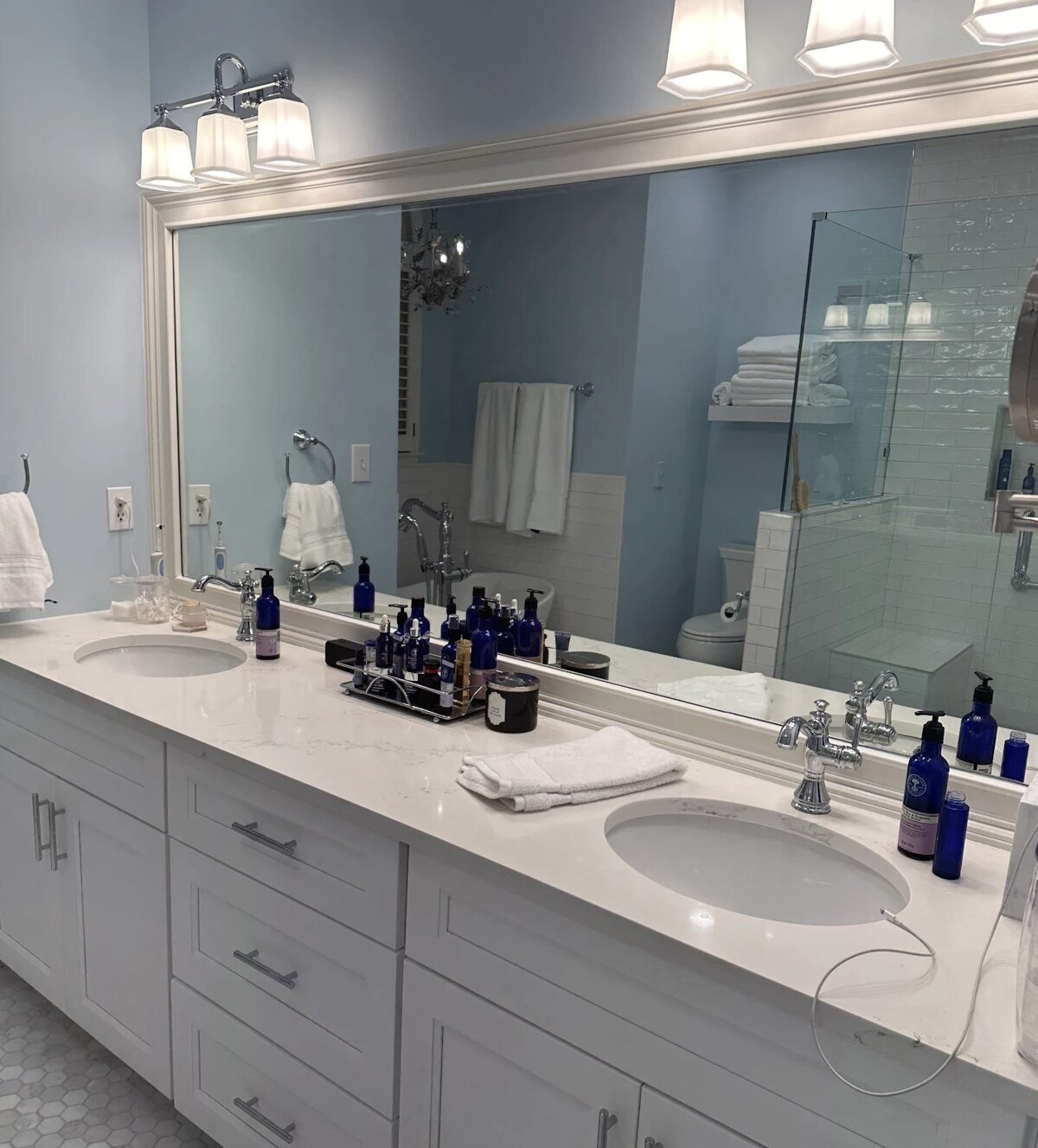 Bathroom remodel with double sink vanity and marble countertop by Encompass Contracting in Athens, GA